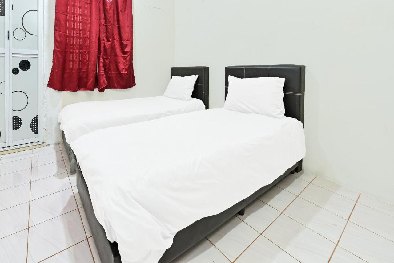 Oyo 90596 Casaria Inn Paka Extérieur photo